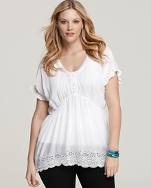 A dressed-up version of the classic white tee, this Johnny Was Collection Plus tunic boasts flirty eyelet trim and a flattering A-line silhouette for a feminine take on the closet staple. A dressed-up version of the classic white tee, this Johnny Was Collection Plus tunic boasts flirty eyelet trim and a flattering A-line silhouette for a feminine take on the closet staple.