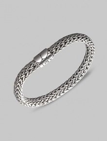 From the Kali Collection. An intricately woven strand of sterling silver with a textured barrel clasp. Sterling silver Length, about 7½ Push-lock clasp Made in Bali.