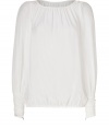 Finish your outfit on an ethereal note with Rachel Zoes pristine ivory silk top - Gathered round neckline, long sleeves, pleated cuffs with metal zipper detail, elasticized hemline, sheer - Loosely fitted - Wear with slim-fit separates and sleek leather accessories