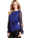 Ready for evening, this midnight blue top from T Tahari looks extra elegant with sheer split sleeves and opaque cuffs.