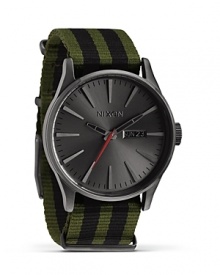 Nixon shows it's stripes with this military-inspired watch. A perfect fusion of performance and commanding style, it flaunts a flexible a nylon bracelet, 100 meter water resistance, and custom colored oxide face. Nixon shows it's stripes with this military-inspired watch. A perfect fusion of performance and commanding style, it flaunts a flexible a nylon bracelet, 100 meter water resistance, and custom colored oxide face.