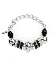 Bold beaded design takes your look to new heights. Nine West's stretch bracelet slips effortlessly over your wrist and provides a look that's polished and chic. Plastic jet beads and clear stones shine in a silver tone mixed metal setting. Approximate diameter: 2-1/4 inches. Bold beaded design takes your look to new heights. Nine West's stretch bracelet slips effortlessly over your wrist and provides a look that's polished and chic. Plastic jet beads and clear stones shine in a silver tone mixed metal setting. Approximate diameter: 2-1/4 inches.