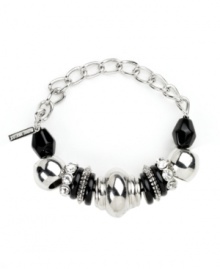 Bold beaded design takes your look to new heights. Nine West's stretch bracelet slips effortlessly over your wrist and provides a look that's polished and chic. Plastic jet beads and clear stones shine in a silver tone mixed metal setting. Approximate diameter: 2-1/4 inches.