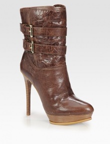 Adjustable buckle straps top this elevated ankle boot rendered in distressed leather for a worn-in style. Stacked heel, 4¾ (120mm)Stacked platform, 1 (25mm)Compares to a 3¾ heel (95mm)Shaft, 7¾Leg circumference, 11½Leather upperPull-on style with adjustable buckle strapsLeather lining and solePadded insoleImported Adjustable buckle straps top this elevated ankle boot rendered in distressed leather for a worn-in style. Stacked heel, 4¾ (120mm)Stacked platform, 1 (25mm)Compares to a 3¾ heel (95mm)Shaft, 7¾Leg circumference, 11½Leather upperPull-on style with adjustable buckle strapsLeather lining and solePadded insoleImported