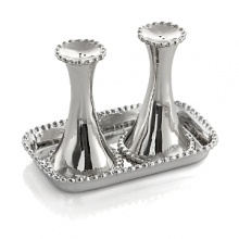 Marked by incredible handcrafting, this salt & pepper set, displayed on a perfectly sized tray, features countless molten beads carefully placed by a highly skilled artisan. The look is streamlined, timeless, organic and soulful. Marked by incredible handcrafting, this salt & pepper set, displayed on a perfectly sized tray, features countless molten beads carefully placed by a highly skilled artisan. The look is streamlined, timeless, organic and soulful.