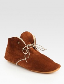 Cozy shearling lines this ultra-comfortable suede design with a rubber sole for added traction. Suede upperShearling liningRubber solePadded insoleMade in Italy Cozy shearling lines this ultra-comfortable suede design with a rubber sole for added traction. Suede upperShearling liningRubber solePadded insoleMade in Italy