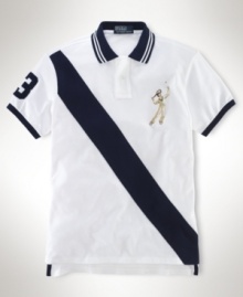 Crafted in breathable cotton mesh, a trim-fitting tennis polo exudes athletic style with a bold banner stripe and an embroidered tennis player at the chest. Crafted in breathable cotton mesh, a trim-fitting tennis polo exudes athletic style with a bold banner stripe and an embroidered tennis player at the chest.