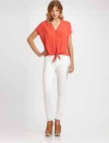 Flowing silk v-neck with a button front and unexpected self tie at the hem. V-neckShort sleevesButton frontSelf tie at hemSilkDry cleanImportedModel shown is 5'10½ (179cm) wearing US size 4. Flowing silk v-neck with a button front and unexpected self tie at the hem. V-neckShort sleevesButton frontSelf tie at hemSilkDry cleanImportedModel shown is 5'10½ (179cm) wearing US size 4.