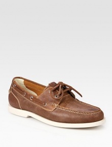 Traditional boat shoe style with contrast rubber sole and lace-up detail.Leather upperLeather liningPadded insoleRubber soleImported Traditional boat shoe style with contrast rubber sole and lace-up detail.Leather upperLeather liningPadded insoleRubber soleImported