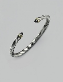 From the Cable Classic Collection. A signature Yurman cable of sterling silver, richly crowned in 14K yellow gold with black onyx end caps. Sterling silver and 14k yellow gold Black onyx Cable, 5mm Diameter, about 2½ Imported From the Cable Classic Collection. A signature Yurman cable of sterling silver, richly crowned in 14K yellow gold with black onyx end caps. Sterling silver and 14k yellow gold Black onyx Cable, 5mm Diameter, about 2½ Imported