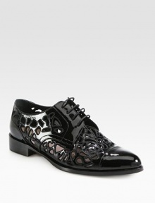 For a skin-baring effect, this glossy patent leather staple with elaborate cutouts is the perfect choice. Stacked heel, 1¼ (30mm)Patent leather upperLeather lining and solePadded insoleMade in Italy For a skin-baring effect, this glossy patent leather staple with elaborate cutouts is the perfect choice. Stacked heel, 1¼ (30mm)Patent leather upperLeather lining and solePadded insoleMade in Italy