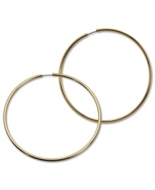 Infinite style with endless hoops. These GUESS earrings are crafted in gold tone mixed metal. Approximate diameter: 2-1/2 inches.