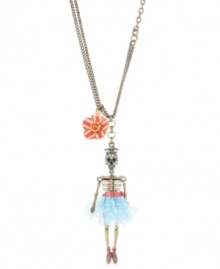 Creepy chic. Betsey Johnson's trendy long pendant features a sailor skeleton dressed in a blue tutu with a red belt. Necklace set in mixed metal with a red flower charm and crystal accents. Approximate length: 26 inches + 3-inch extender. Approximate drop: 4-1/4 inches.