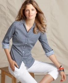 A graphic logo print and classic silhouette makes this shirt from Tommy Hilfiger an easy staple. Dress it up with a structured skirt or keep it casual with white capris. A graphic logo print and classic silhouette makes this shirt from Tommy Hilfiger an easy staple. Dress it up with a structured skirt or keep it casual with white capris.