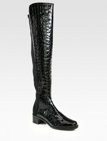 Head-turning boot of crocodile-embossed patent leather with an elasticized back panel for easy on and off access. Stacked heel, 1¾ (45mm)Shaft, 21Leg circumference, 13Crocodile-print patent leather with back elastic panelingPull-on styleLeather liningRubber solePadded insoleImported Head-turning boot of crocodile-embossed patent leather with an elasticized back panel for easy on and off access. Stacked heel, 1¾ (45mm)Shaft, 21Leg circumference, 13Crocodile-print patent leather with back elastic panelingPull-on styleLeather liningRubber solePadded insoleImported