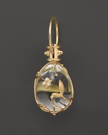 Diamond-studded, 18K yellow gold vines wrap a crystal egg. By Temple St. Clair. Diamond-studded, 18K yellow gold vines wrap a crystal egg. By Temple St. Clair.