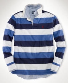 A long-sleeved striped rugby shirt is cut for a trim, modern fit from rustic utility cotton with a lightly filled diamond-quilted yoke for an athletic appeal.