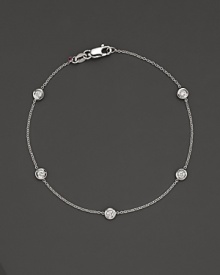 White gold bezel-set diamond cluster bracelet. With signature ruby accent. Designed by Roberto Coin. White gold bezel-set diamond cluster bracelet. With signature ruby accent. Designed by Roberto Coin.
