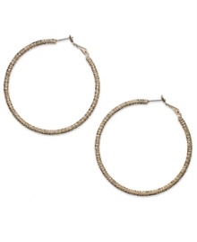 This time with feeling. INC International Concepts' large hoop earrings, crafted from gold-tone mixed metal, are textured to give them a different stylish sensation. Approximate diameter: 2-1/4 inches. This time with feeling. INC International Concepts' large hoop earrings, crafted from gold-tone mixed metal, are textured to give them a different stylish sensation. Approximate diameter: 2-1/4 inches.