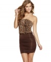 A solid-color mini skirt anchors an animal print top on this dress of perfect pairs from Sugar & Spice!