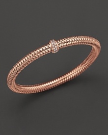 A row of diamonds binds this woven 18K rose gold bracelet from Roberto Coin. A row of diamonds binds this woven 18K rose gold bracelet from Roberto Coin.