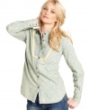An allover floral print adds a hint of femininity to this otherwise boyish chambray shirt by Free People!