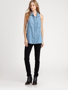 Button-down chambray shirt reinvented by a sleeveless silhouette, pleated racerback and split back hem that hits below the hips. Point collarHidden button frontSleevelessPleated racerbackSplit back hem hits below the hipsTencelMachine washMade in USA of imported fabricModel shown is 5'9 (176cm) wearing US size Small. Button-down chambray shirt reinvented by a sleeveless silhouette, pleated racerback and split back hem that hits below the hips. Point collarHidden button frontSleevelessPleated racerbackSplit back hem hits below the hipsTencelMachine washMade in USA of imported fabricModel shown is 5'9 (176cm) wearing US size Small.