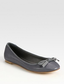 Sophisticated leather flat with grosgrain trim and a dainty bow. Leather upperLeather lining and solePadded insoleImportedOUR FIT MODEL RECOMMENDS ordering true size. 