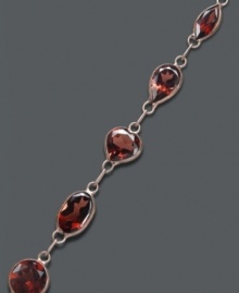 Add richness to your look in red-hot color. Oval and round-cut garnets (7-1/2 ct. t.w.) shine in a 14k gold setting. Approximate length: 7 inches. Add richness to your look in red-hot color. Oval and round-cut garnets (7-1/2 ct. t.w.) shine in a 14k gold setting. Approximate length: 7 inches.
