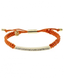 Set the tone for summer! Michael Kors' chic macrame bracelet features woven coral cotton cord with a gold tone mixed metal bar, accented with glistening pave glass stones. Clasp and logo charms crafted in gold tone mixed metal. Approximate diameter: 2 to 2-3/4 inches. Bracelet adjusts to fit wrist. Set the tone for summer! Michael Kors' chic macrame bracelet features woven coral cotton cord with a gold tone mixed metal bar, accented with glistening pave glass stones. Clasp and logo charms crafted in gold tone mixed metal. Approximate diameter: 2 to 2-3/4 inches. Bracelet adjusts to fit wrist.
