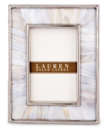 Enhance the look of any photo when framed in the beauty of Mother of Pearl. A slim line of metal surrounds this natural composition with the classic style of Lauren Ralph Lauren.