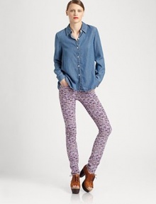 Tap into the chambray trend with this lengthy denim button-down shirt. Point collarButton frontLong sleeves with buttoned cuffsLonger length hits below the hipsLyocellMachine washImportedModel shown is 5'10 (177cm) wearing US size 2. Tap into the chambray trend with this lengthy denim button-down shirt. Point collarButton frontLong sleeves with buttoned cuffsLonger length hits below the hipsLyocellMachine washImportedModel shown is 5'10 (177cm) wearing US size 2.