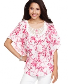 Lovely lace makes a statement on BandolinoBlu's flowing batwing top! The spring-ready floral print gives it extra charm. Lovely lace makes a statement on BandolinoBlu's flowing batwing top! The spring-ready floral print gives it extra charm.