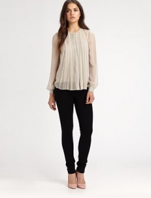 Ultra-flattering pleats adorn the front of this semi-sheer, silky must-have.Round necklineLong sleevesFront buttonHi-lo hemAbout 26 from shoulder to hemSilkDry cleanImportedModel shown is 5'10 (177cm) wearing US size 4. Ultra-flattering pleats adorn the front of this semi-sheer, silky must-have.Round necklineLong sleevesFront buttonHi-lo hemAbout 26 from shoulder to hemSilkDry cleanImportedModel shown is 5'10 (177cm) wearing US size 4.