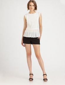 Semi-sheer cotton crewneck has playful front pleating, cap sleeves and a figure-enhancing peplum hem that hits below the hips. CrewneckCap sleevesPeplum hem hits below the hipsFully linedCottonDry cleanImported of Italian fabricModel shown is 5'10 (177cm) wearing US size Small. Semi-sheer cotton crewneck has playful front pleating, cap sleeves and a figure-enhancing peplum hem that hits below the hips. CrewneckCap sleevesPeplum hem hits below the hipsFully linedCottonDry cleanImported of Italian fabricModel shown is 5'10 (177cm) wearing US size Small.