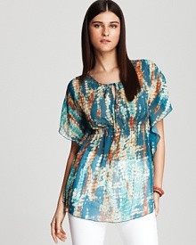 A sheer cascade of tie-dye infuses this Shiloh770 blouse with boho flair. Play up the print with crisp white denim and colorful stacked bangles for eclectic elegance. A sheer cascade of tie-dye infuses this Shiloh770 blouse with boho flair. Play up the print with crisp white denim and colorful stacked bangles for eclectic elegance.