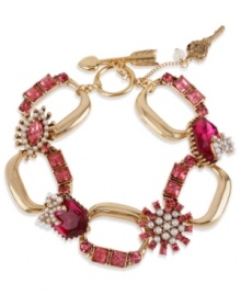 A little romance from Betsey Johnson! This toggle bracelet features fuchsia-colored crystal accents, glass pearls and key and arrow charms. Crafted in antiqued gold tone mixed metal. Approximate length: 8 inches. A little romance from Betsey Johnson! This toggle bracelet features fuchsia-colored crystal accents, glass pearls and key and arrow charms. Crafted in antiqued gold tone mixed metal. Approximate length: 8 inches.