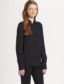 Make a fashion-forward impression with this lengthy silk blouse, defined by contrast trim and a split shirttail hem. Contrasting stand collarLong sleeves with buttoned cuffsButton frontSingle front patch pocketShirttail hem with back slitSilkDry cleanImportedModel shown is 5'7 (174cm) wearing US size 2. Make a fashion-forward impression with this lengthy silk blouse, defined by contrast trim and a split shirttail hem. Contrasting stand collarLong sleeves with buttoned cuffsButton frontSingle front patch pocketShirttail hem with back slitSilkDry cleanImportedModel shown is 5'7 (174cm) wearing US size 2.