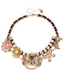 A crowning achievement. This frontal necklace from Betsey Johnson is crafted from gold-tone mixed metal and purple grosgrain ribbon, which provides the foundation for whimsical charms adorned with glass crystal accents. Approximate length: 15 inches + 3-inch extender. Approximate drop: 1-3/4 inches. A crowning achievement. This frontal necklace from Betsey Johnson is crafted from gold-tone mixed metal and purple grosgrain ribbon, which provides the foundation for whimsical charms adorned with glass crystal accents. Approximate length: 15 inches + 3-inch extender. Approximate drop: 1-3/4 inches.