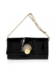 Perfect for carrying with festive cocktail frocks, Diane von Furstenbergs black snakeskin clutch is a contemporary choice packed with luxe appeal - Flap with mixed metal magnetic logo engraved circle clasp, removable gold-toned chain strap, inside zippered back wall pocket - Team everything from cocktail dresses and flats to evening gowns and statement heels Perfect for carrying with festive cocktail frocks, Diane von Furstenbergs black snakeskin clutch is a contemporary choice packed with luxe appeal - Flap with mixed metal magnetic logo engraved circle clasp, removable gold-toned chain strap, inside zippered back wall pocket - Team everything from cocktail dresses and flats to evening gowns and statement heels
