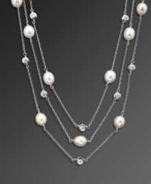 Add a little illumination with this elegant illusion necklace by CRISLU. Feature three delicate strands of bezel-set cubic zirconias (4-3/4 ct. t.w.) and freshwater pearls (8 mm). Set in platinum over sterling silver. Approximate length: 48 inches. Add a little illumination with this elegant illusion necklace by CRISLU. Feature three delicate strands of bezel-set cubic zirconias (4-3/4 ct. t.w.) and freshwater pearls (8 mm). Set in platinum over sterling silver. Approximate length: 48 inches.