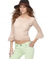 Sweet yet a little bit sexy, contrast this sheer crochet lace Free People top over everyday denim for a hot spring look!