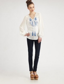 Delicate embroidery highlights airy chiffon in this Moroccan-inspired confection.V neckline with tasselsShirring at shouldersButton half-placketGathered sleevesEmbroidered button cuffsShirttail hemAbout 27 from shoulder to hemRayonDry cleanImportedModel shown is 5'9 (175cm) wearing US size 4. Delicate embroidery highlights airy chiffon in this Moroccan-inspired confection.V neckline with tasselsShirring at shouldersButton half-placketGathered sleevesEmbroidered button cuffsShirttail hemAbout 27 from shoulder to hemRayonDry cleanImportedModel shown is 5'9 (175cm) wearing US size 4.