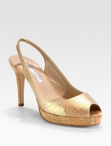 Iridescent peep toe silhouette in genuine snakeskin, elevated by a towering cork platform and heel. Cork heel, 3¾ (95mm)Cork platform, ¾ (20mm)Compares to a 3 heel (75mm)Lamé snakeskin upperPeep toeElasticized slingback strapLeather lining and solePadded insoleMade in Italy Iridescent peep toe silhouette in genuine snakeskin, elevated by a towering cork platform and heel. Cork heel, 3¾ (95mm)Cork platform, ¾ (20mm)Compares to a 3 heel (75mm)Lamé snakeskin upperPeep toeElasticized slingback strapLeather lining and solePadded insoleMade in Italy
