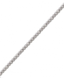 Add sheer elegance to your ensemble with a simple, sparkling bracelet. Swarovski's tennis-style bracelet features bezel-set round-cut crystals in silver tone mixed metal. Approximate length: 7 inches. Add sheer elegance to your ensemble with a simple, sparkling bracelet. Swarovski's tennis-style bracelet features bezel-set round-cut crystals in silver tone mixed metal. Approximate length: 7 inches.