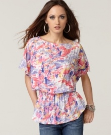 Go floral in this striking top from Calvin Klein Jeans, featuring a chic boat neckline and easy fit. Pair it with jeans and flats for springtime style that glows! Go floral in this striking top from Calvin Klein Jeans, featuring a chic boat neckline and easy fit. Pair it with jeans and flats for springtime style that glows!