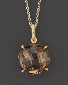 Pavé diamonds and smoky quartz sparkle in a 18K yellow gold setting. Pavé diamonds and smoky quartz sparkle in a 18K yellow gold setting.