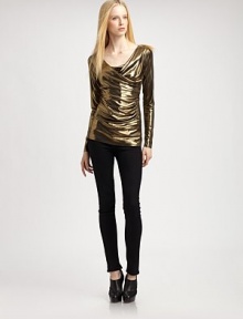 Shimmer away in this fitted metallic top with long sleeves and an asymmetrical cowlneck. Asymmetrical cowlneckLong sleeves95% polyester/5% spandexDry cleanMade in USA of imported fabricModel shown is 5'9½ (176cm) wearing US size Small. Shimmer away in this fitted metallic top with long sleeves and an asymmetrical cowlneck. Asymmetrical cowlneckLong sleeves95% polyester/5% spandexDry cleanMade in USA of imported fabricModel shown is 5'9½ (176cm) wearing US size Small.