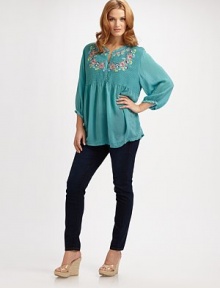 Pretty horizontal pintucking and exquisite embroidery distinguish the bodice of this graceful tunic of dreamy crinkle rayon.Narrow band neckline with embroidered detailButton placketColorful floral embroidery at bodice, back and one side of hemFull three-quarter sleeves with button band cuffs and zigzag embroideryAbout 31½ from shoulder to hemRayonImportedMachine wash Pretty horizontal pintucking and exquisite embroidery distinguish the bodice of this graceful tunic of dreamy crinkle rayon.Narrow band neckline with embroidered detailButton placketColorful floral embroidery at bodice, back and one side of hemFull three-quarter sleeves with button band cuffs and zigzag embroideryAbout 31½ from shoulder to hemRayonImportedMachine wash