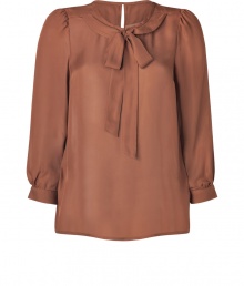 Sophisticated and sweet, Marc by Marc Jacobs tied silk top is chic office staple, essential for taking you through the workweek in style - Rounded collar with tie, 3/4 sleeves, slightly gathered shoulders, buttoned cuffs, buttoned slit at nape - Softly tailored fit - Wear with everything from leather leggings and ankle boots to pencil skirts and heels Sophisticated and sweet, Marc by Marc Jacobs tied silk top is chic office staple, essential for taking you through the workweek in style - Rounded collar with tie, 3/4 sleeves, slightly gathered shoulders, buttoned cuffs, buttoned slit at nape - Softly tailored fit - Wear with everything from leather leggings and ankle boots to pencil skirts and heels